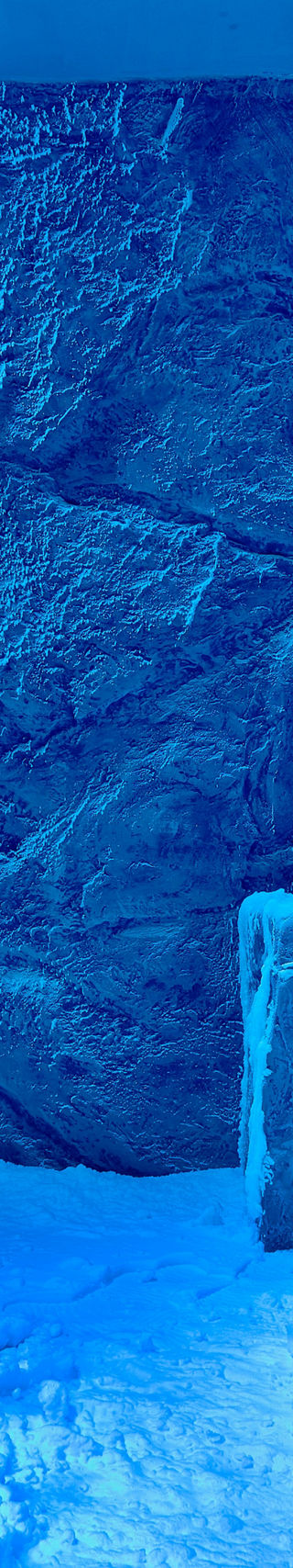 Snow-filled room with icy blue lighting
