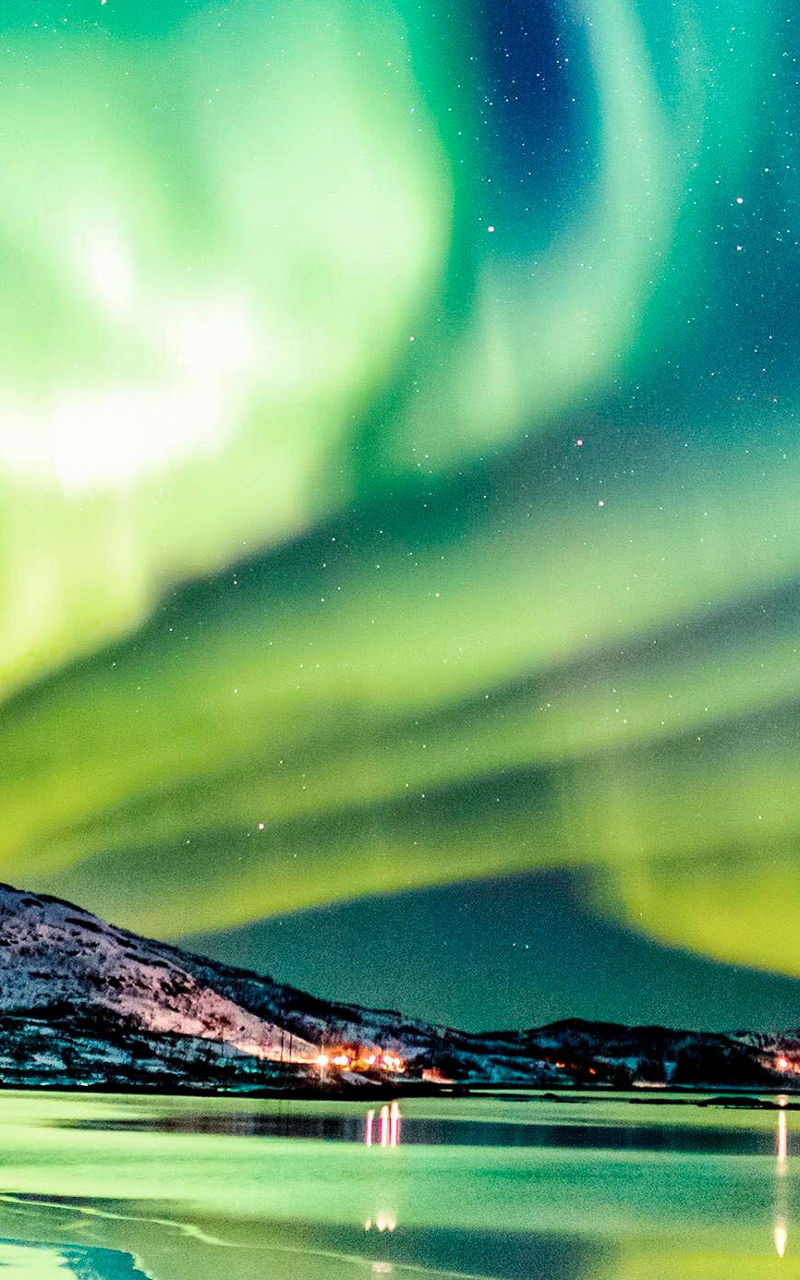 Northern Lights over snowy landscape