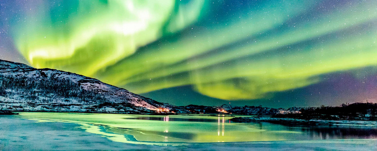 Northern Lights over snowy landscape