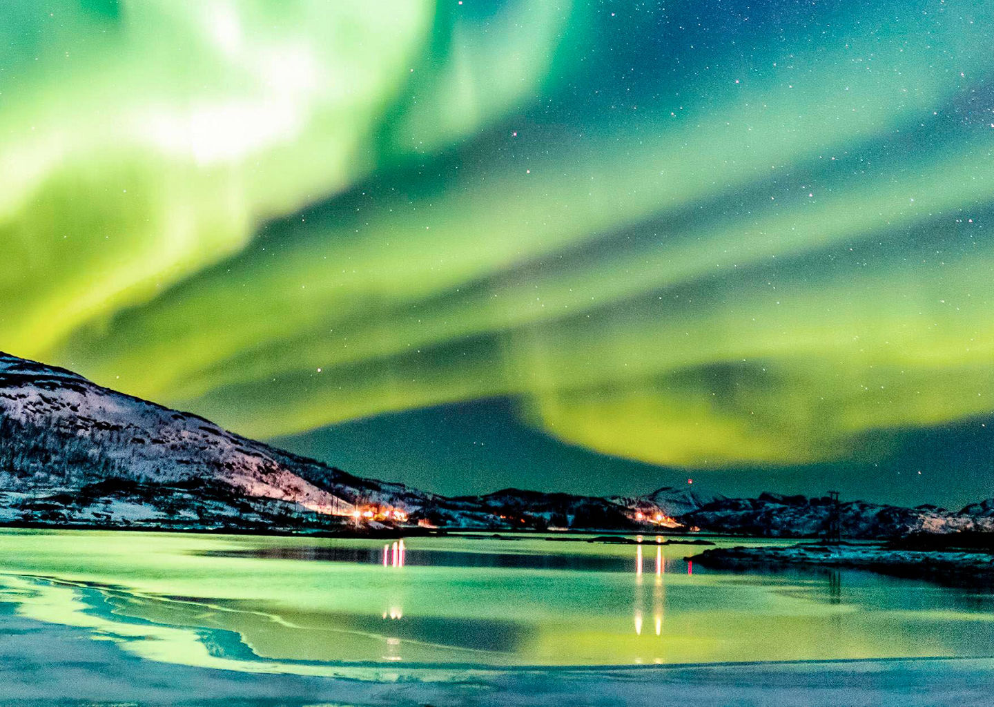 Northern Lights over snowy landscape