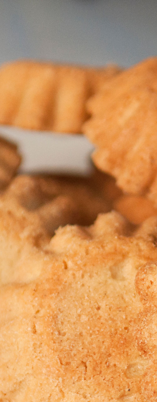 Golden baked cookies on white plate