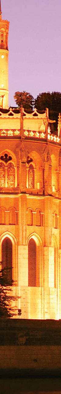 Illuminated Basilica at Sunset Reflection