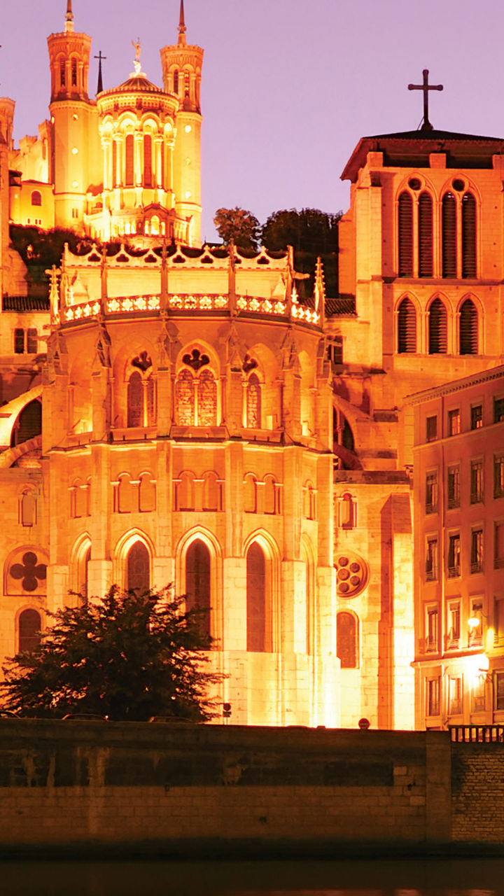Illuminated Basilica at Sunset Reflection