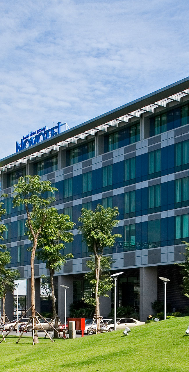 Modern building with glass facade and tower