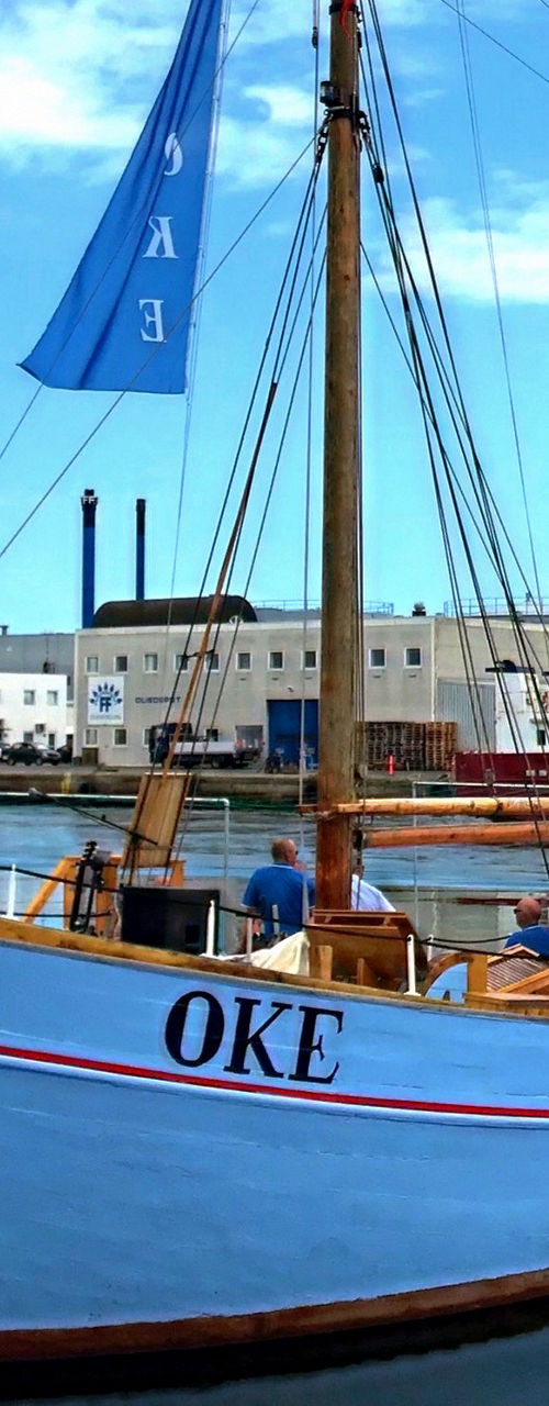 Wooden fishing boat docked at harbor