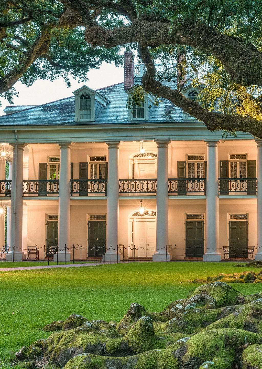 Historic mansion surrounded by oak trees