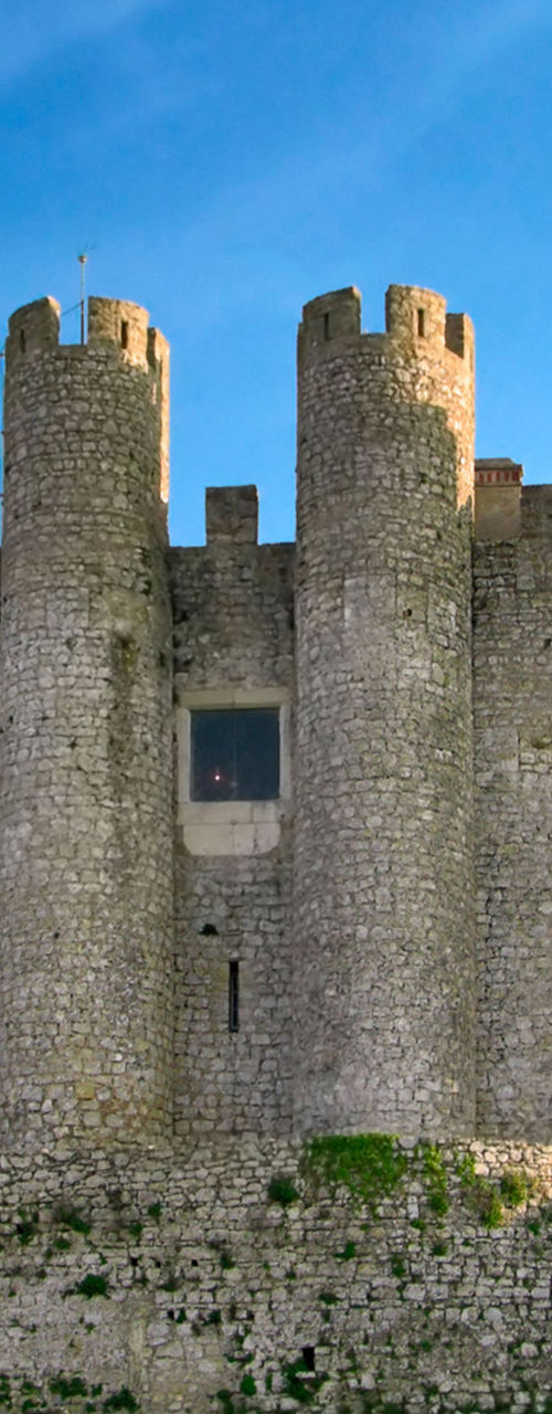 Medieval stone castle with blue sky