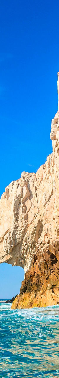 Rock formations in turquoise ocean waters