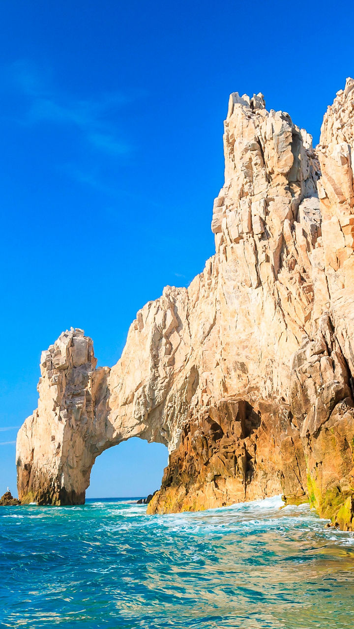 Rock formations in turquoise ocean waters