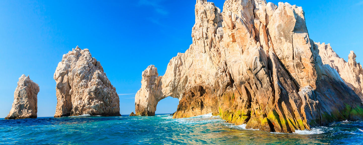 Rock formations in turquoise ocean waters