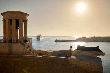 Historic coastal view with cruise ship