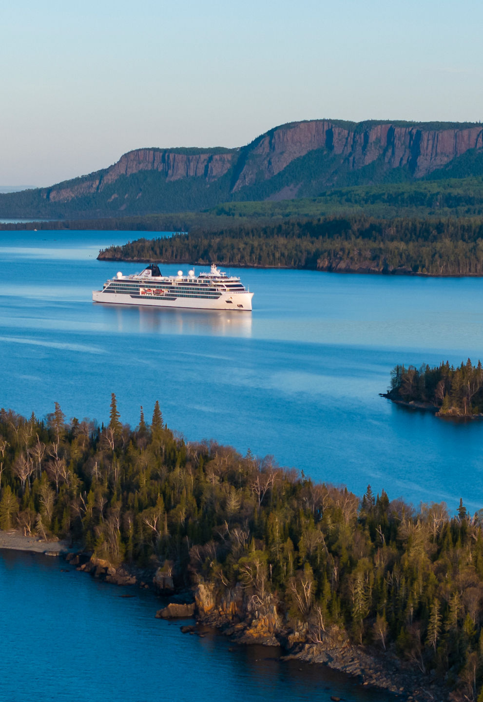 Cruise ship near scenic coastal islands