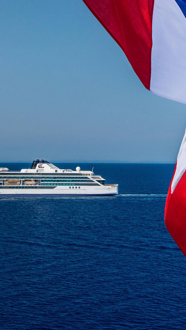 Cruise ship with Norwegian flag at sea