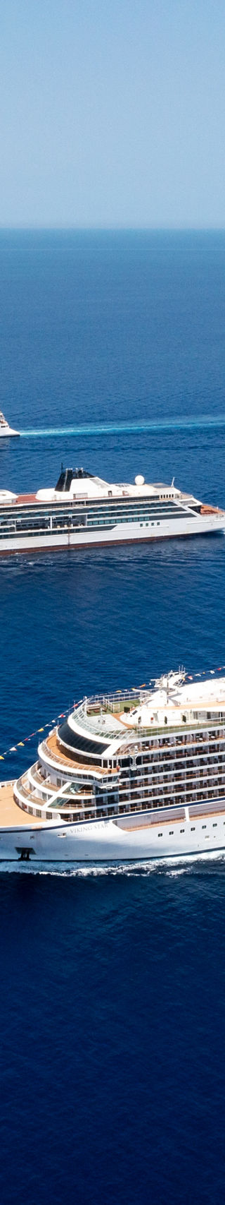 Luxury cruise ships sailing in open sea