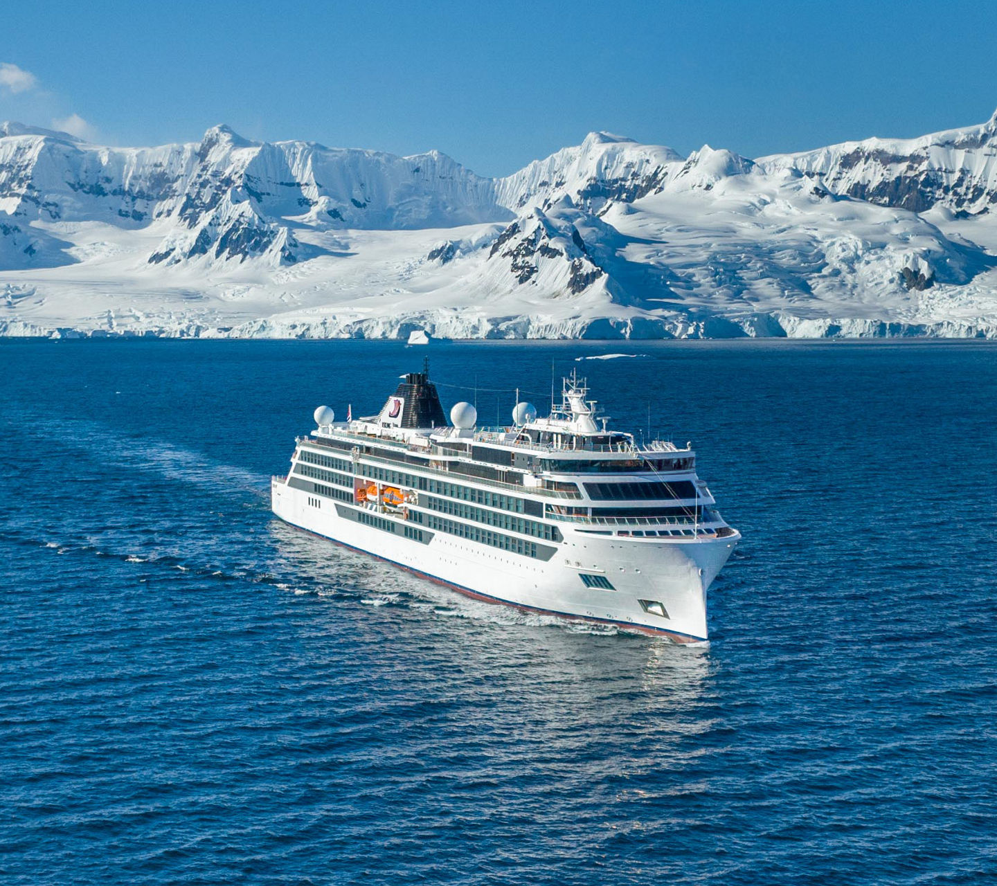 Cruise ship sailing near icy mountains