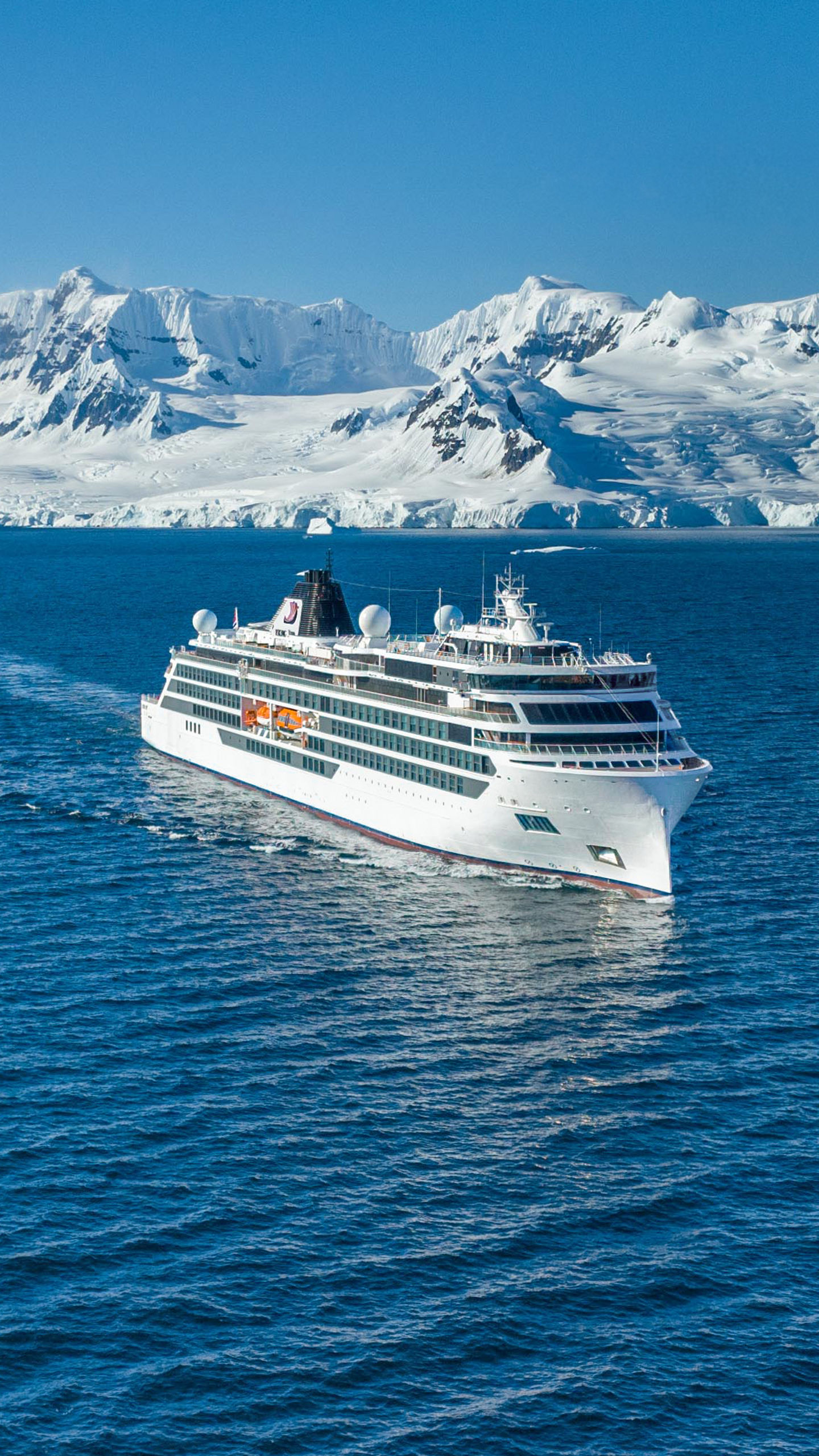 Cruise ship sailing near icy mountains