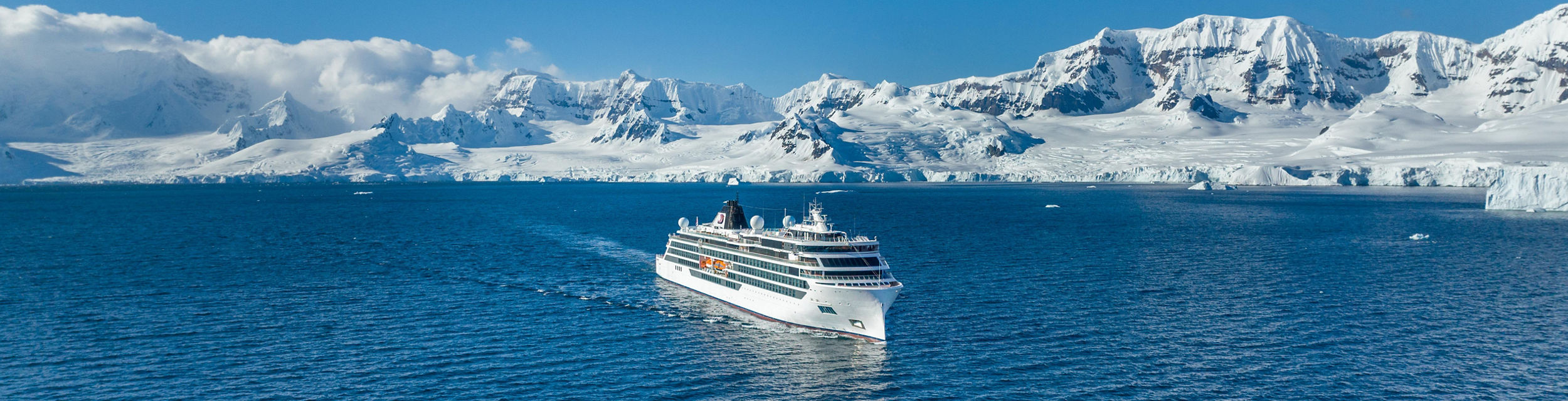 Cruise ship sailing near icy mountains