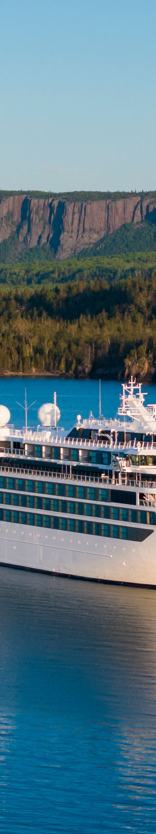 Luxury cruise ship on serene blue waters