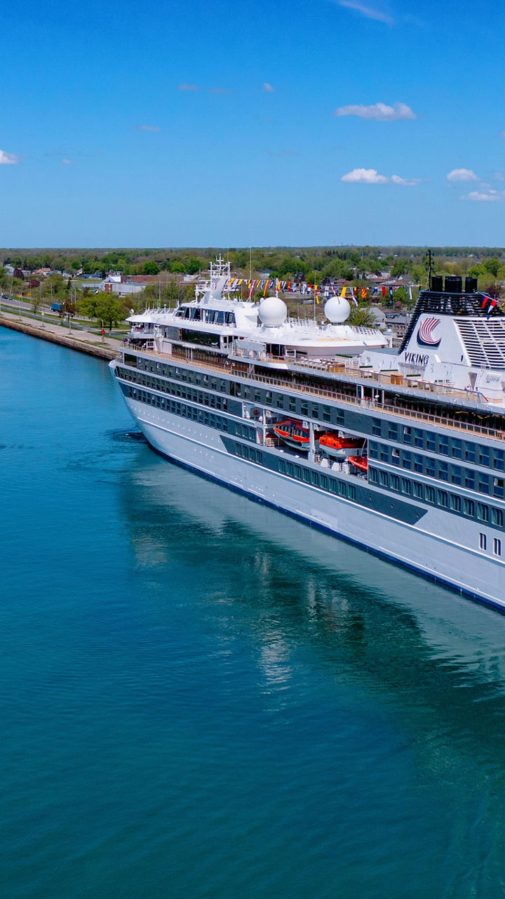 Luxury cruise ship sailing through canal