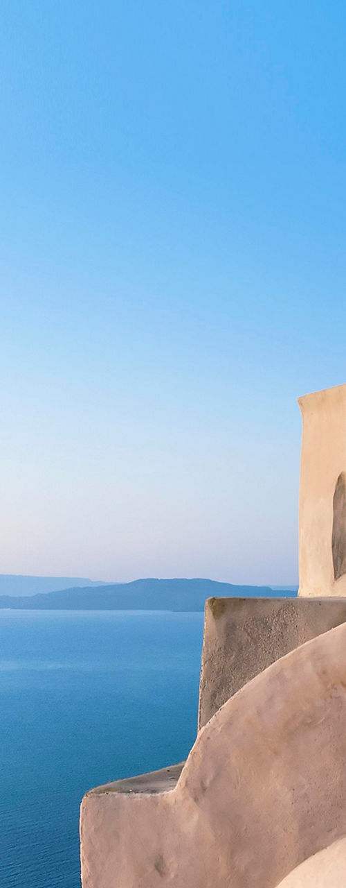 Mediterranean dome overlooking serene blue sea