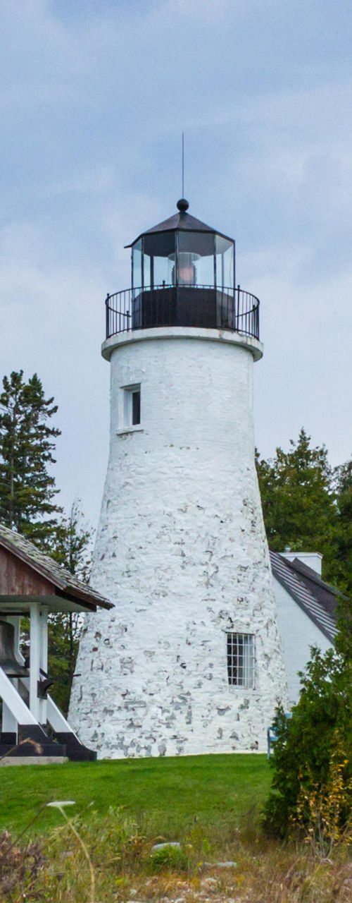 Historic lighthouse with American flag