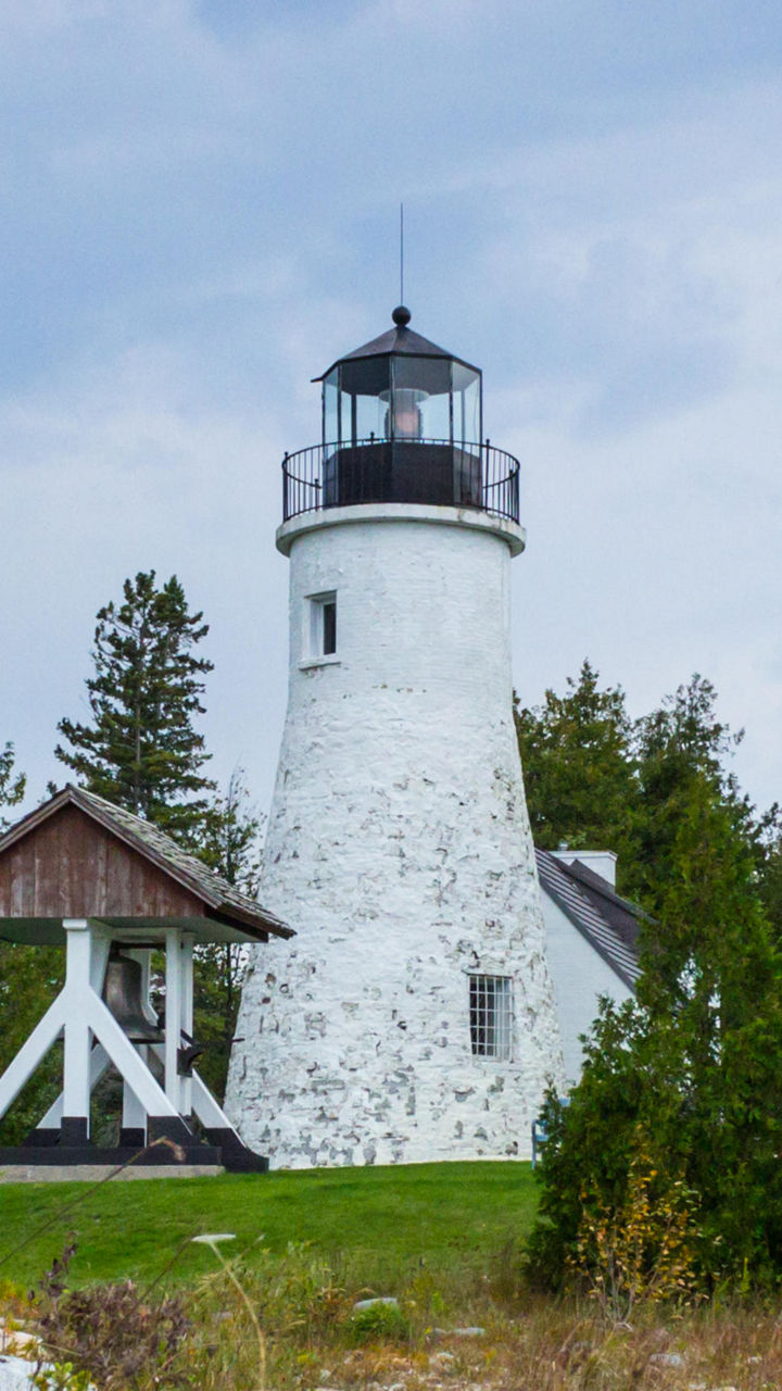 Historic lighthouse with American flag