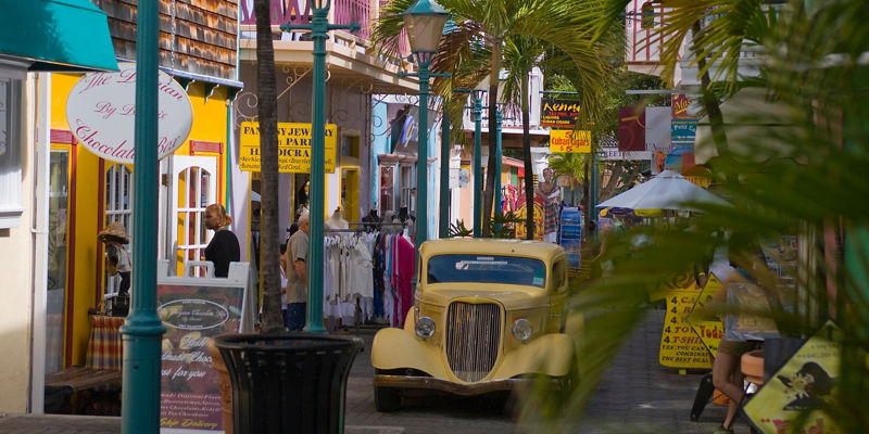 Colorful street with vintage yellow car