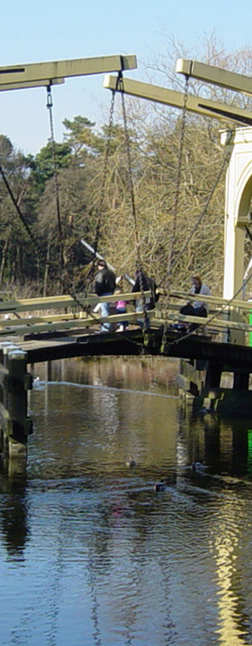 Traditional Dutch village with windmill and bridge