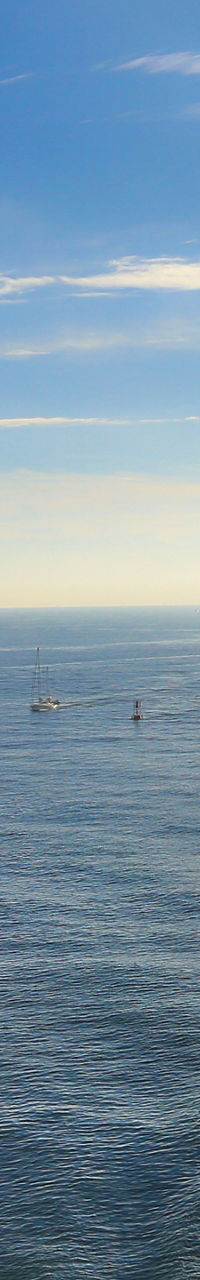 Cruise ship deck overlooking calm ocean waters