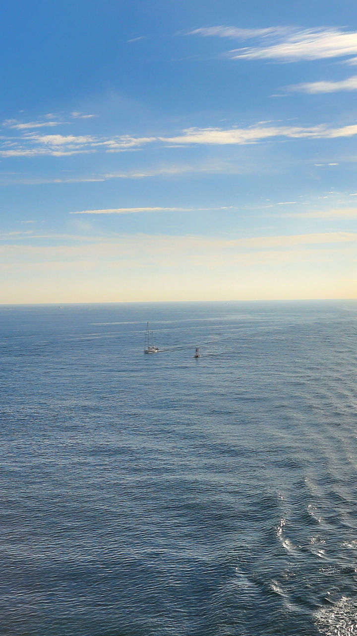 Cruise ship deck overlooking calm ocean waters