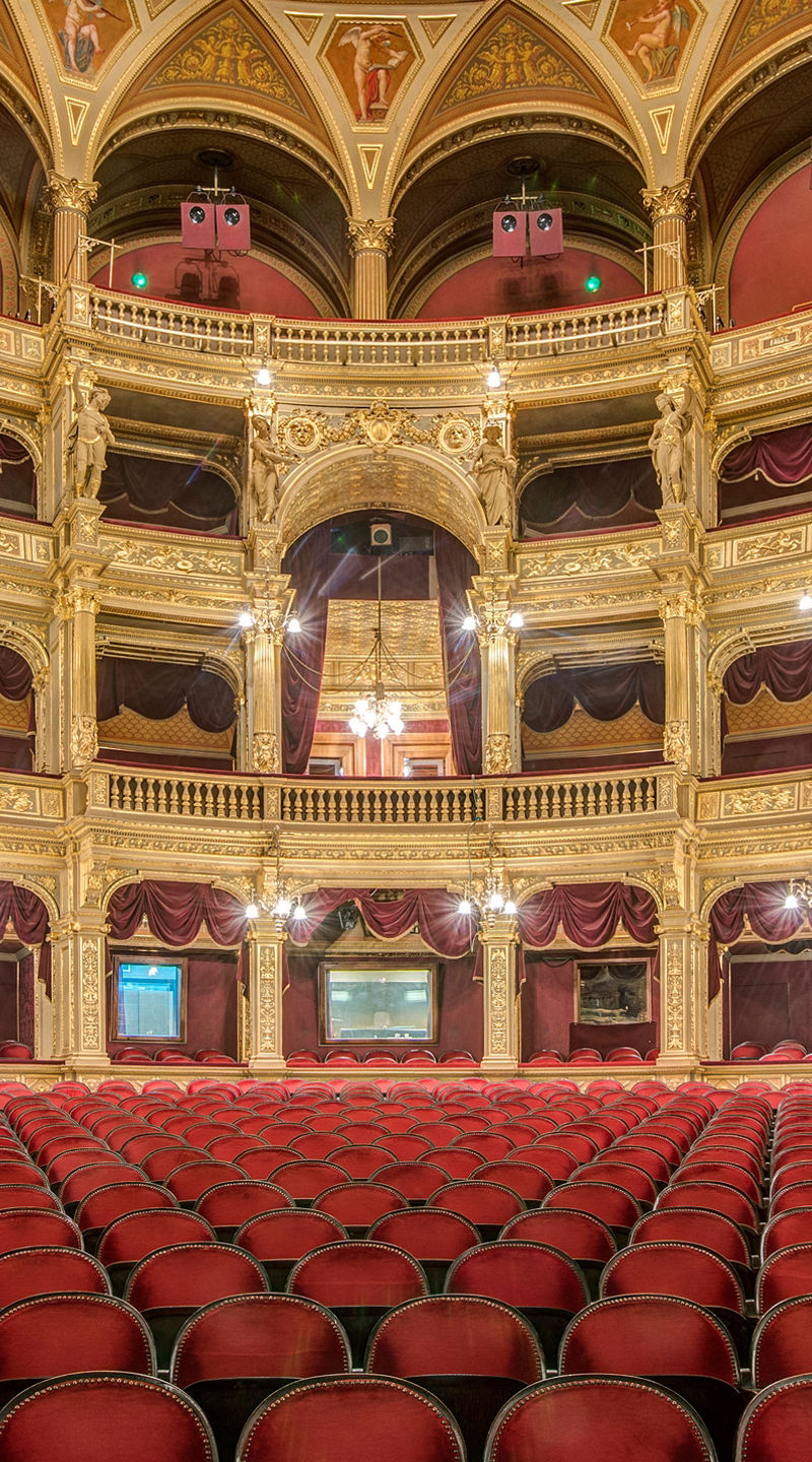 Elegant opera house interior with red seating