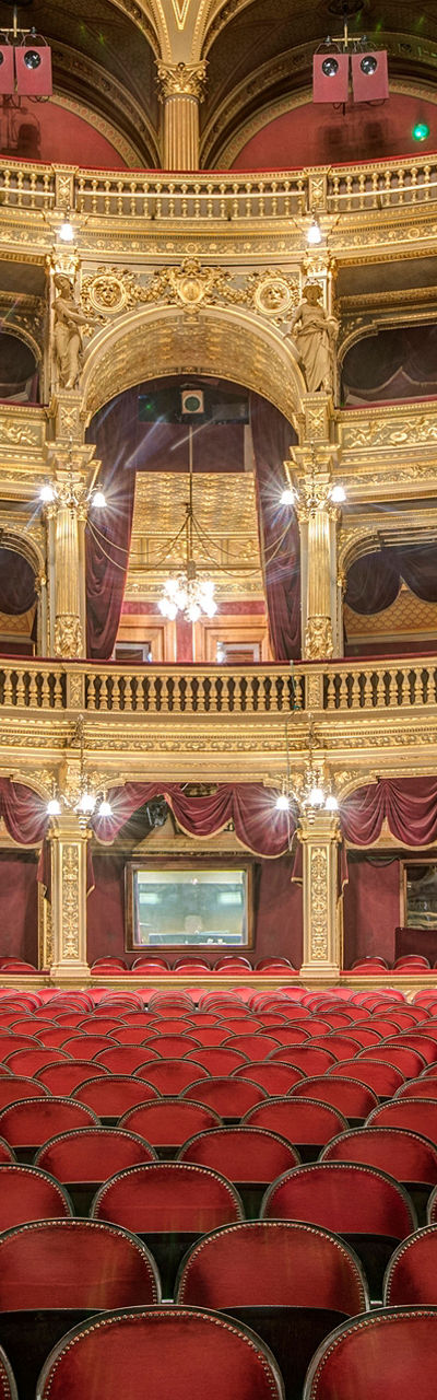 Elegant opera house interior with red seating