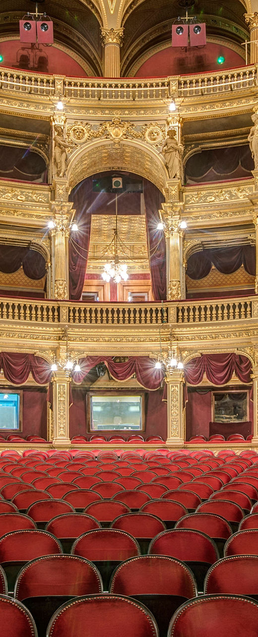 Elegant opera house interior with red seating