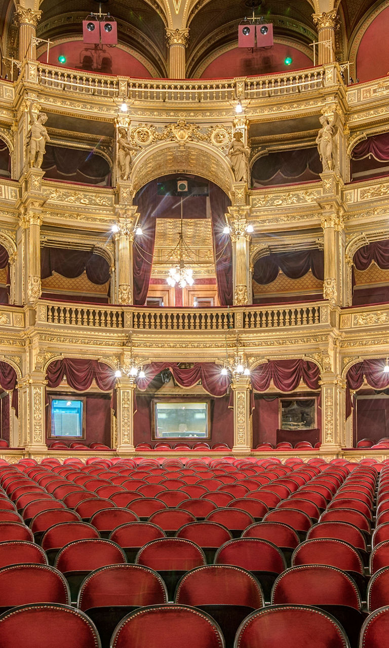 Elegant opera house interior with red seating