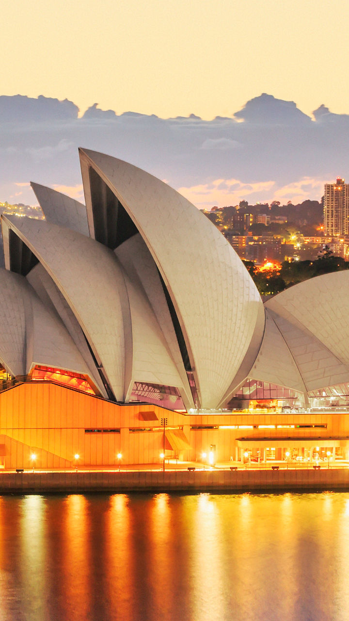 Sydney Opera House at sunset with cityscape
