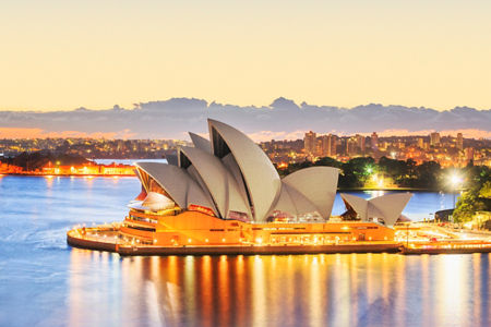 Sydney Opera House at sunset with cityscape