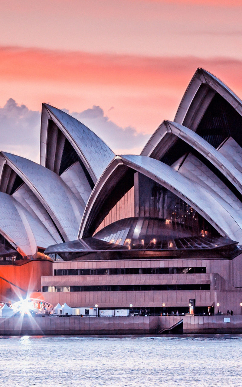 Sydney Opera House at sunset over water