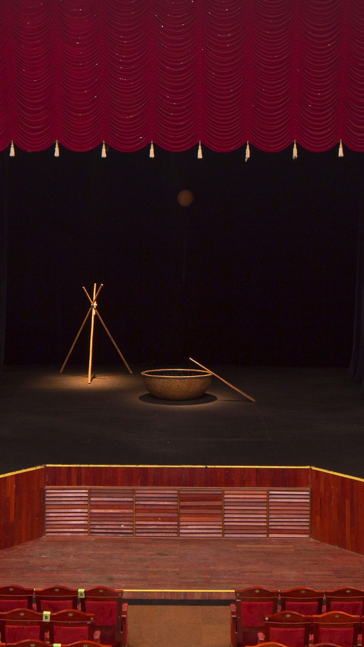 Elegant theater stage with red curtains