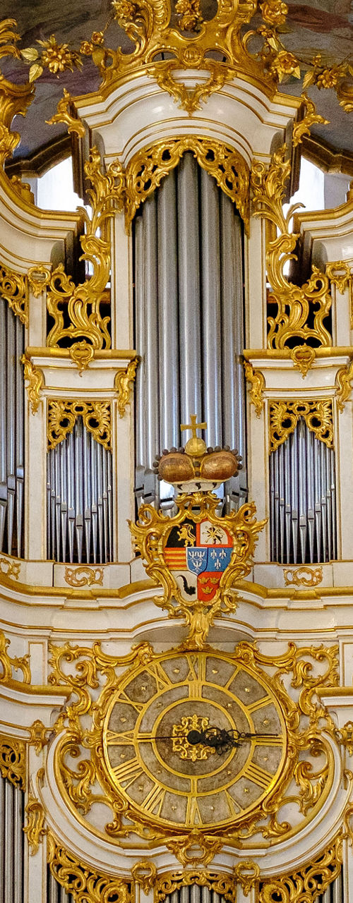 Baroque pipe organ with ornate gold details