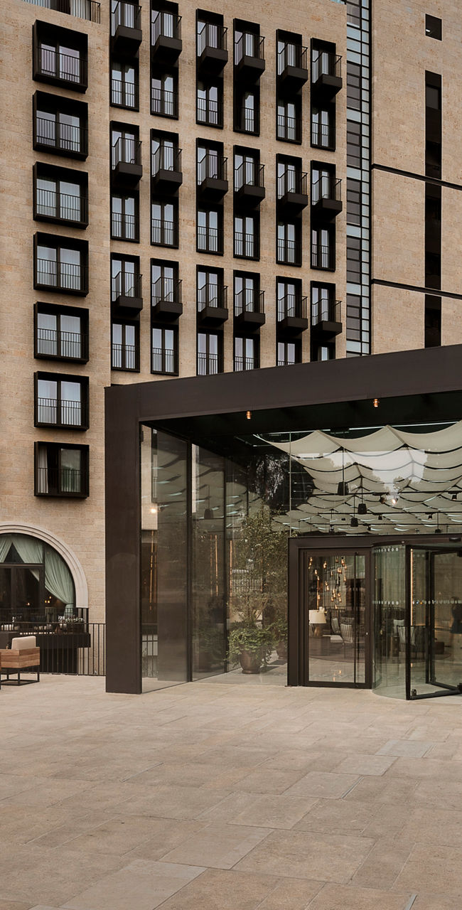 Modern hotel exterior with Orient branding