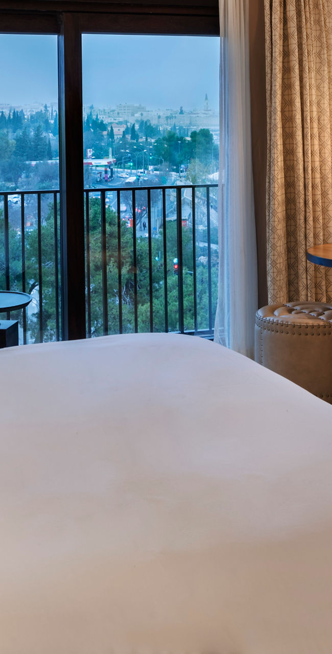 Modern hotel room with scenic balcony view