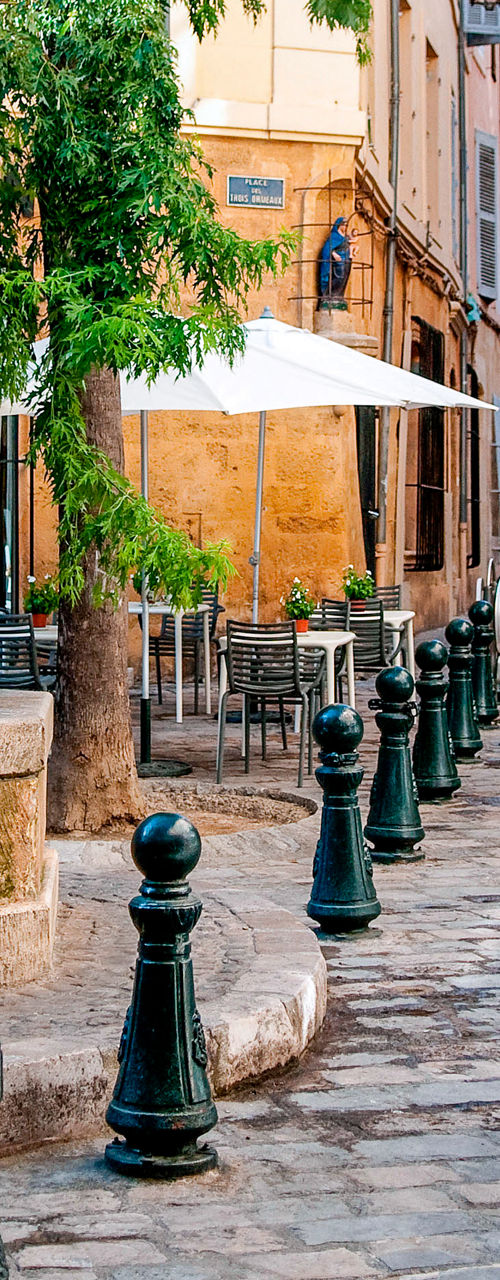 Charming European street with stone fountain