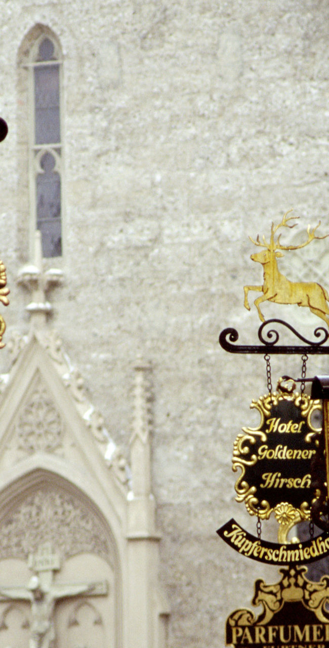 Historic street signs in European town