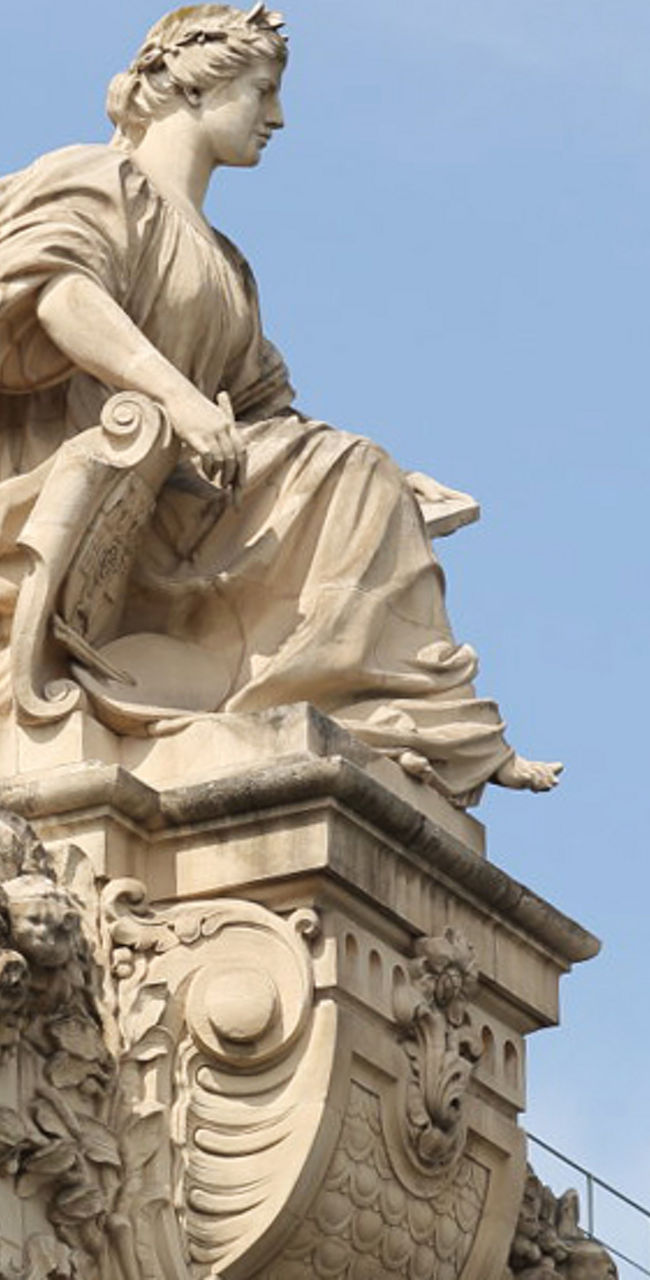 Historic building facade with statue detail