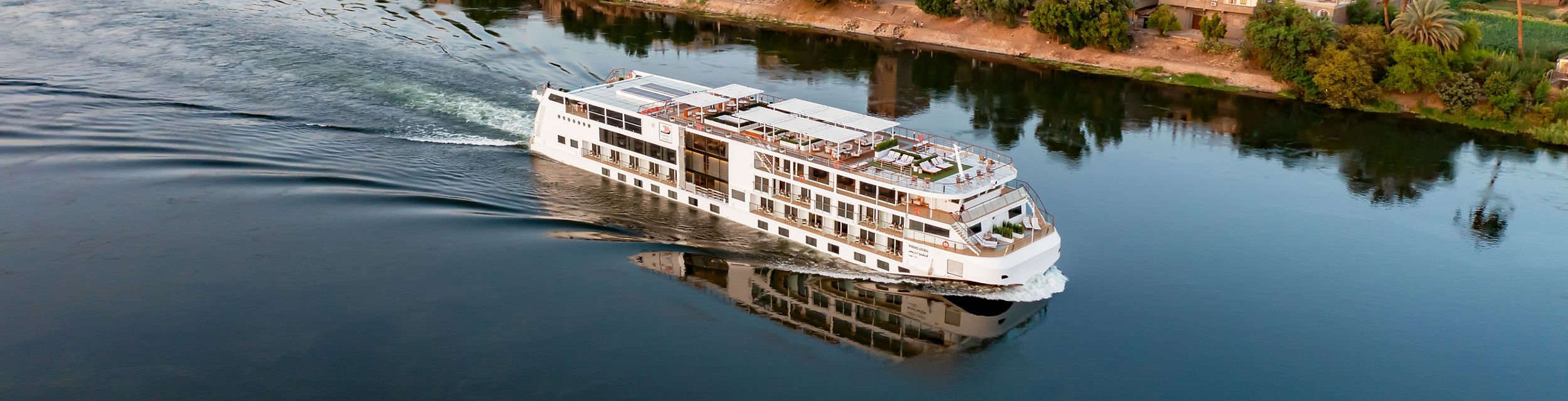 Luxury river cruise ship on calm waters