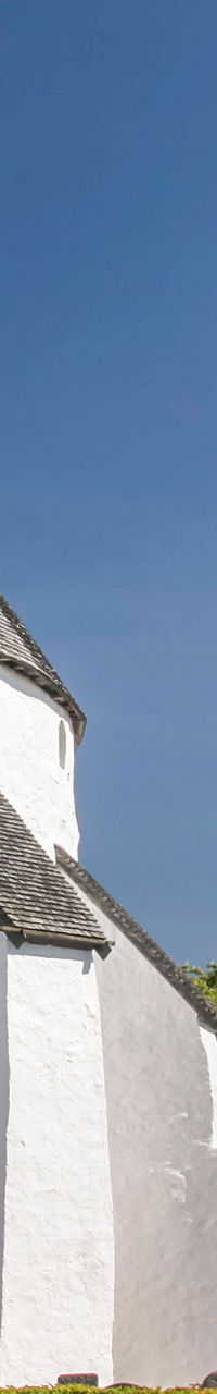 Historic white round church with gardens