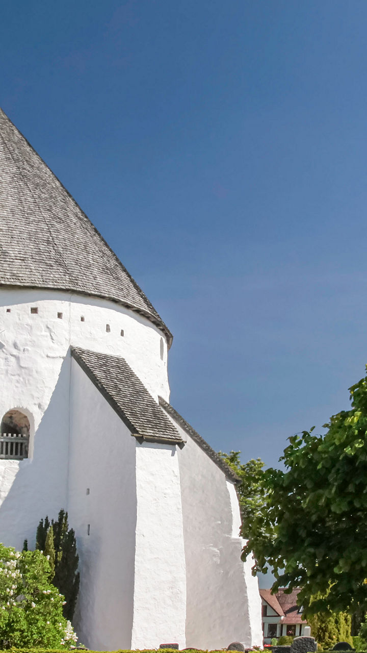 Historic white round church with gardens