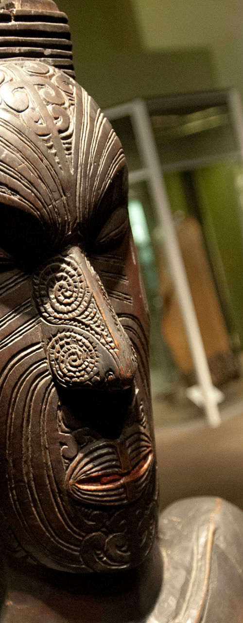 Intricate wooden sculpture in museum setting