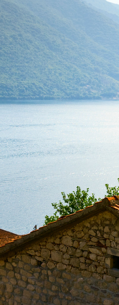 Scenic coastal village with mountain backdrop