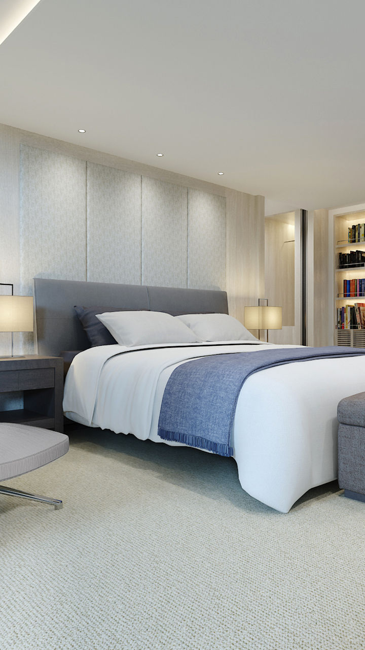 Modern bedroom with neutral decor and seating